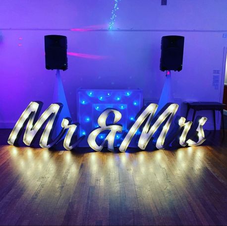 Large freestanding letters spelling out Mr and Mrs.
