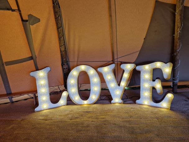 Freestanding letters spelling out the word love.